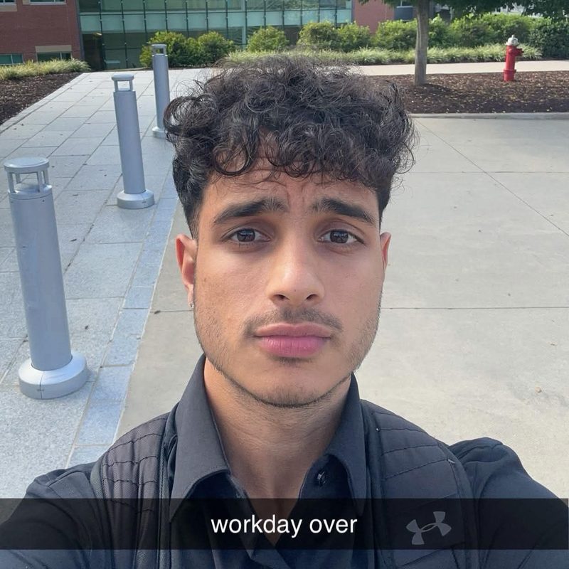 Ritesh outside the office after work, captioned 'workday over'